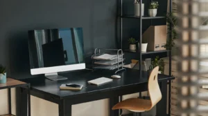Aesthetic Home Office Ideas: The Complete 2026 Style Guide for a Beautiful, Productive Workspace 8 Dark academia home office featuring a mahogany desk, brass banker's lamp, stacked hardcover books, a tufted leather chair, and a tall bookshelf against a deep green wall