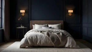 Dark moody bedroom with deep navy walls, warm brass sconces, ivory linen bedding, and a plush area rug.