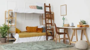 Space‑Saving Furniture Ideas for Small Homes and Apartments (2026 Guide) 8 A kids' bunk bed with built-in storage stairs in a small, colorful bedroom showing how vertical sleeping frees play space below.