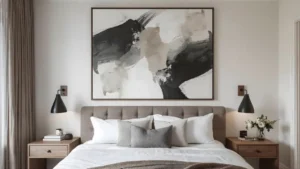 Large abstract artwork above an upholstered bed, creating a dramatic focal point in a woman's bedroom. 
