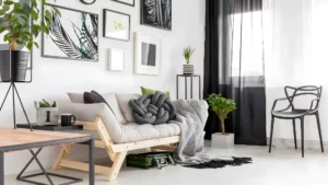 Fully styled feminine studio apartment with defined bed, living, and work zones in warm, cohesive tones