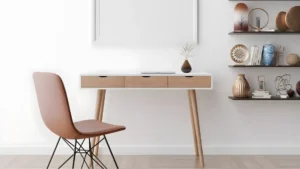 Home Office Desks for Women: How to Choose the Right Desk for Your Style, Space and Work 6 A wall-mounted floating desk in a small studio apartment styled with a minimal lamp, small plant, and a blush desk mat in a feminine workspace.