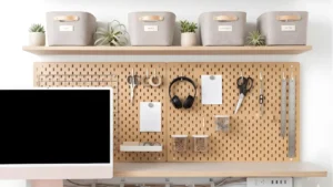 Well-organized closet office showing floating shelves, pegboard, labeled bins, and cable management under the desk.